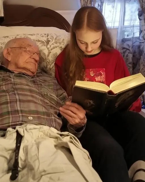 While reading aloud to her blind grandfather, a young girl