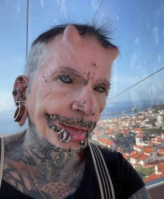 A man with 560 piercings, countless tattoos,