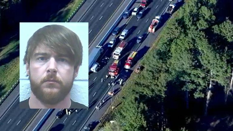 Truck driver charged in de aths