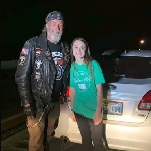 Biker Stops to Help Girl With Flat Tire,